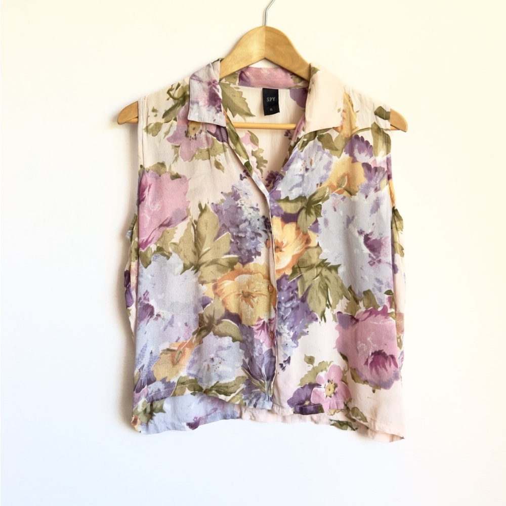 pale pink flowery button down collared sleeveless blouse